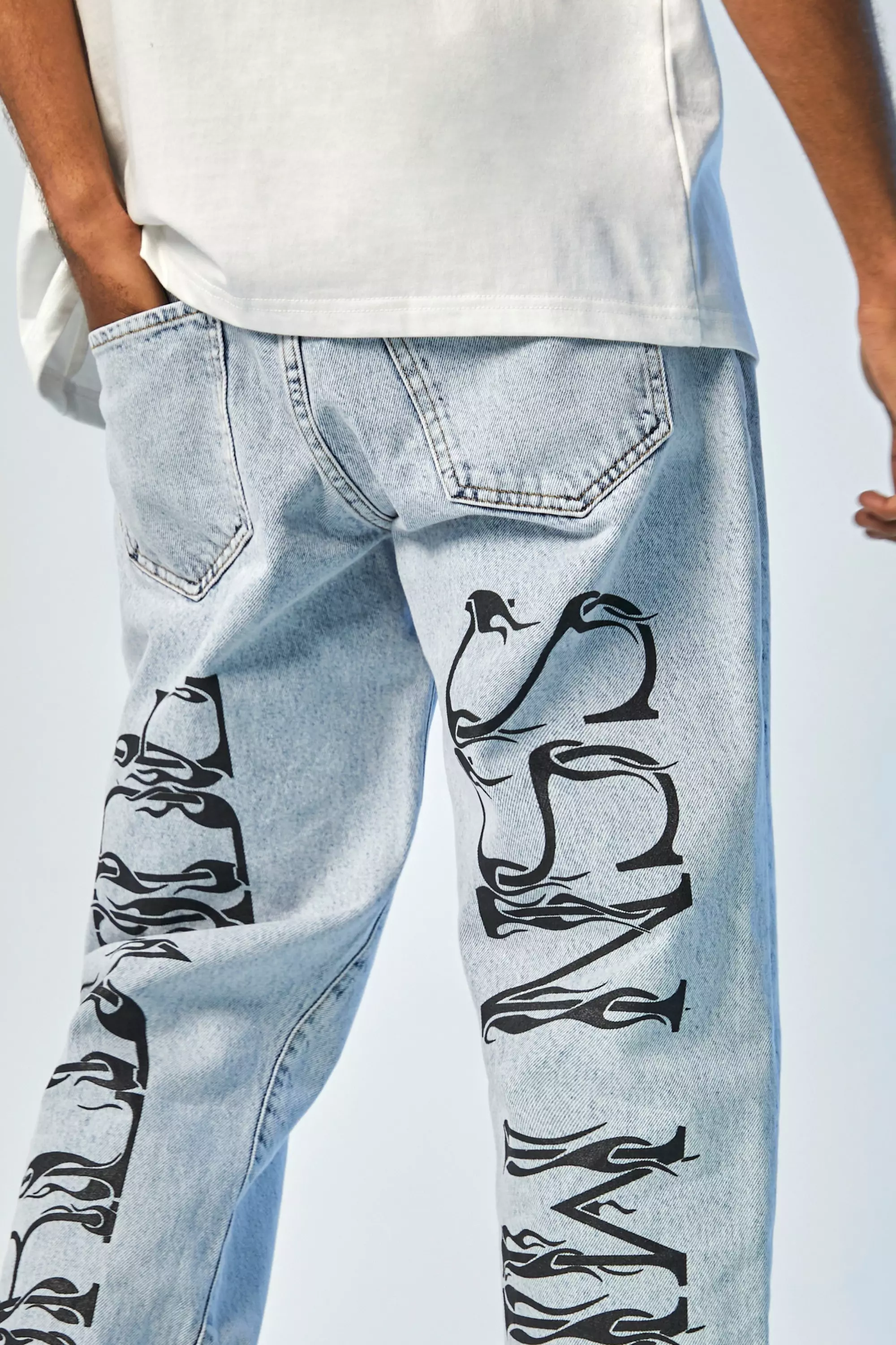 Jeans with store writing on them